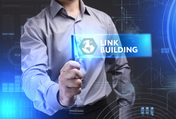Business, Technology, Internet and network concept. Young businessman showing a word in a virtual tablet of the future: Link building