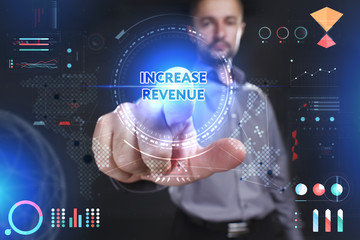 Business, Technology, Internet and network concept. Young businessman showing a word in a virtual tablet of the future: Increase revenue