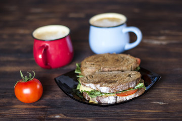 Breakfast, Whole wheat Sandwiches, tomato and coffee for two on wooden table