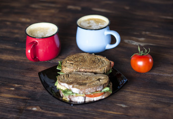 Breakfast, Whole wheat Sandwiches, tomato and coffee for two on wooden table