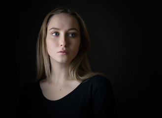 Portrait of a beautiful young woman with blue eyes.