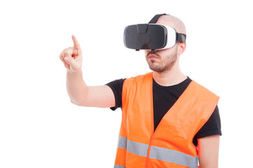 Male engineer pressing on virtual screen