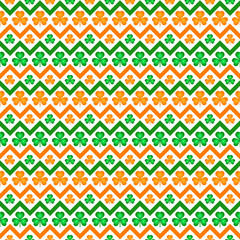 Orange and green shamrock leaves seamless pattern
