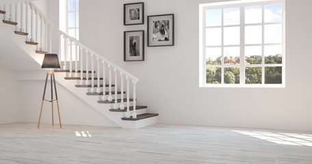 Fototapeta premium White room with stair and green landscape in window. Scandinavian interior design