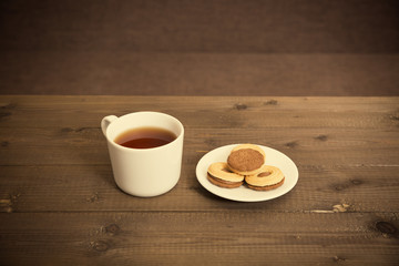 tea and cookies on the old wooden table
