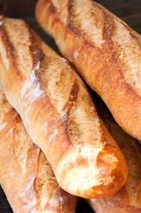 Homemade freshly baked french baguettes. Rustic style. Selective focus.