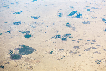 Aerial view of circular fields in the desert in Qatar