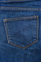blue texture of jeans, stitching on the pants closeup