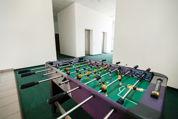 Foosball table soccer .sport team football players