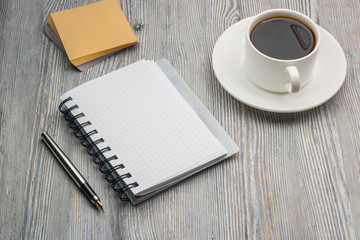 Notebook with pen on an old rustic table. Scratch paper