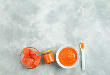 Pumpkin puree in the plate and jar
