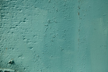 Teal color rough textured painted wall background