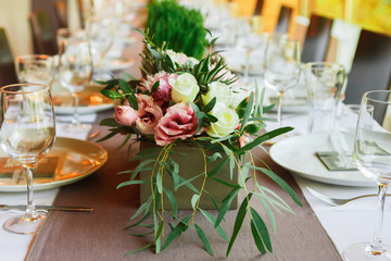 Served wedding table with flowers decorations