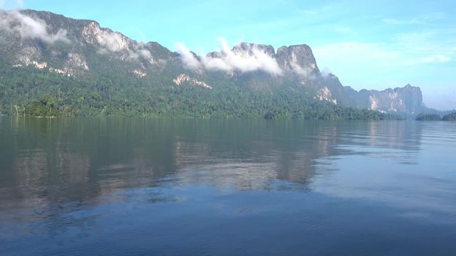 View from boat on Cheow Lan lake in National Park Khao Sok, Thailand, 4k
