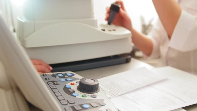 Optometrist equipment in use - generic eye scanner machine
