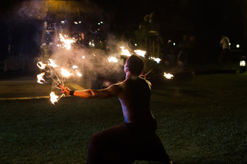 Fire show artist breathe fire in the dark