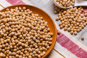 Soybeans over wooden table background