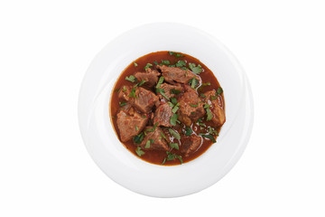 beef stew in tomato sauce traditional Georgian dish chashushuli white background top view