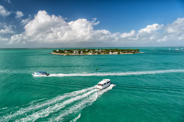 touristic yachts floating by green island at Key West, Florida