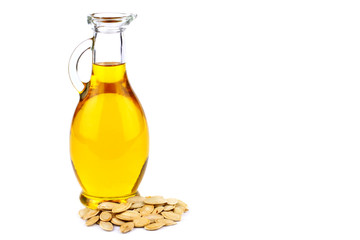 Pumpkin seed oil in bottle on white background