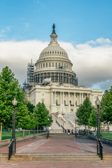 Obraz premium WASHINGTON DC, USA: The United States Capitol view from the street. In 2014, scaffolding was erected around the dome for a restoration project scheduled to be completed by 2017.