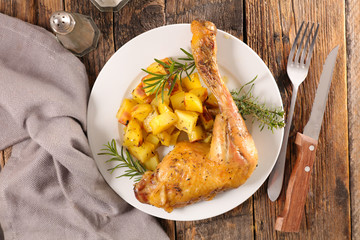 roasted chicken leg and potatoes