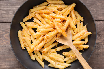 Penne pasta with tomato sauce in a pan