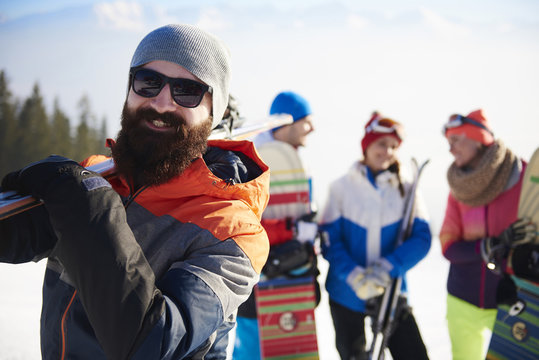 Bearded man with ski equipment