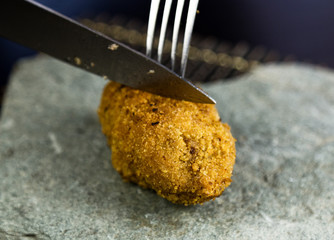 Homemade meat cutlets with parsley, ketchup and bread on white plate