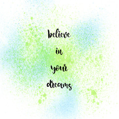 Believe in your dreams on blue and green spray background