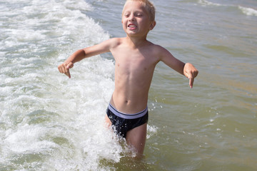 Boy Jumping In Sea Waves