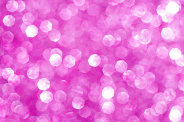 Magic Christmas lights sparkling snow background with stardust and shining stars. Pink white love Holiday postcard concept with space for text. Defocused pink bokeh lights. Valentine's Day.