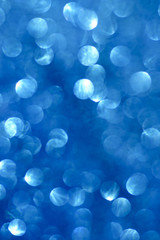 Abstract glittering cobalt blue bokeh background defocused