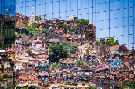 Reflection of Brazilian Slum in Windows of New Modern Business Building in Rio de Janeiro