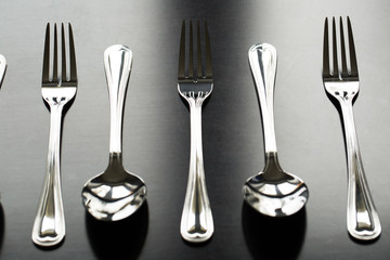 Cutlery on a black background. Fork, spoon, knife.