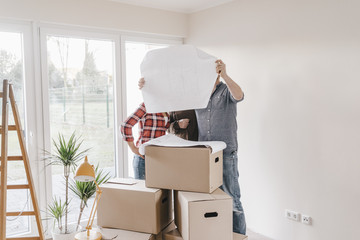 Couple in new home looking at construction plan