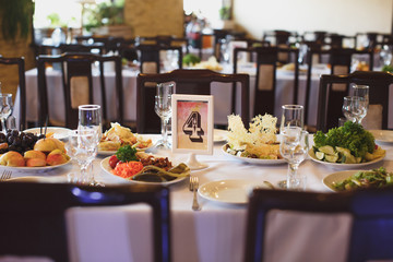 A card with a number on the wedding table