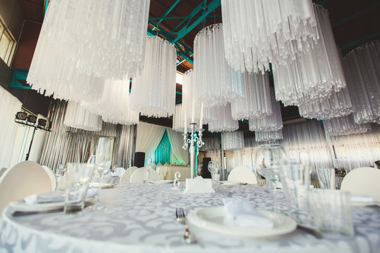 Wedding Banquet in the restaurant, the Tiffany color. Table. Chair. Arch. Tent. Tinsel.