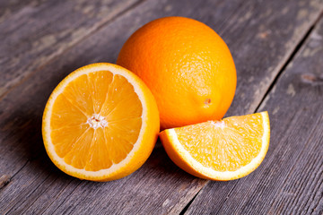 Orange fruit on wooden table background