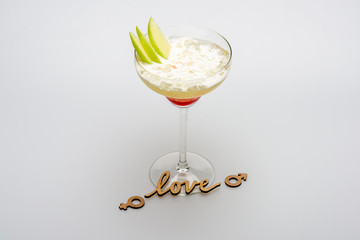 alcohol coctail margarita with pieces of apple and love inscription
