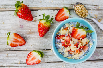 Strawberries and chia seeds grains quinoa and yoghurt. Healthy and delicious super diet.