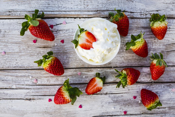 Strawberries with whipped cream, delicious dessert.
