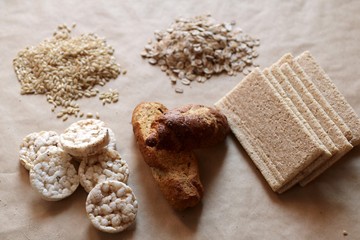 Food high in carbohydrate. Healthy eating, diet  concept. Bread, rice cakes, brown rice, oats.