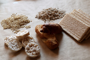 Food high in carbohydrate. Healthy eating, diet  concept. Bread, rice cakes, brown rice, oats.