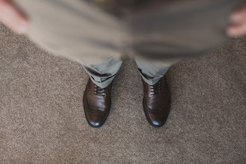 Closeup low angle, feet men,shoes and pants