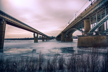Cold winter day. Two bridges across the ice-covered river Ob. Novosibirsk. Russia. © ssabot