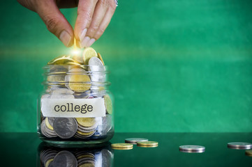 Preparation for future and financial concept. Coins in glass jar with COLLEGE label. Malaysia coins. - obrazy, fototapety, plakaty