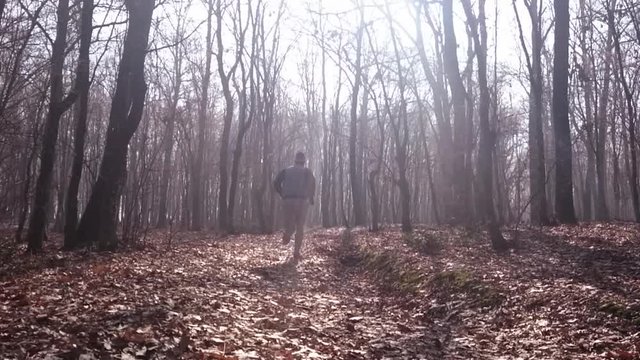 Man running in forest