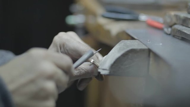 jewel craft sanding a gold ring