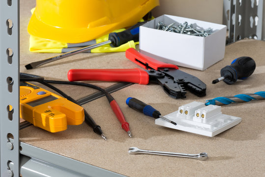 Electrician's Tools and Supplies on Cork-Covered Shelving